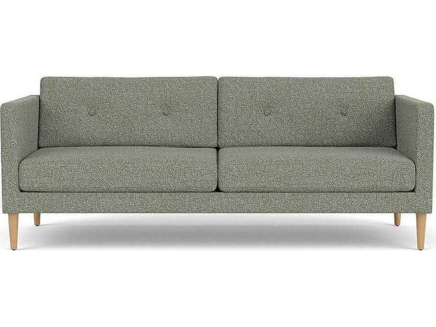 Grey upholstered sofa with wooden legs shown from the front.