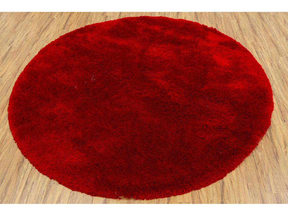 Naya 93-Inch Round Hand-Woven Polyester Shag Area Rug in Red with Cotton Backing